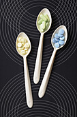 Overhead View of Pills on Spoons