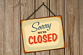 Closed Sign Hanging on Wall