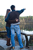 Couple Looking Out Over Lake