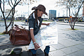 Woman Looking at Map,Mannheim,Baden-Wurttemberg,Germany