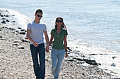 Couple Walking on Beach