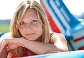 Woman Leaning on Airplane