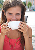 Young Woman Drinking Coffee