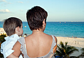 Mother and Son Looking at Beach,Reef Playacar Resort and Spa,Playa del Carmen,Mexico