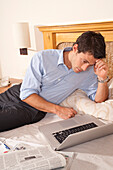 Man using Laptop in Hotel Room,Reef Playacar Resort and Spa,Playa del Carmen,Mexico