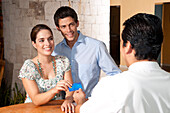 Couple Checking in to Hotel,Reef Playacar Resort and Spa,Playa del Carmen,Mexico