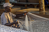 Fisherman mending nets in Fadiouth,Senegal,West Africa,Africa