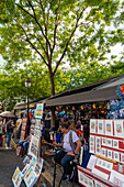 Street scene with stall selling prints,Montmartre,Paris,France,Europe
