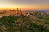 Elevated view of San Gimignano and town at sunset,San Gimignano,Tuscany,Italy,Europe