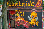 View of colourful fast food outlet near Eastside section of the former Berlin Wall along the Spree River,Berlin,Germany,Europe