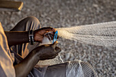 Fisherman mending nets in Fadiouth,Senegal,West Africa,Africa