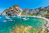 Palmarola bay with boats in crystal clear water,Palmarola island,Ponza municipality,Tyrrhenian sea,Pontine archipelago,Latina Province,Latium (Lazio),Italy,Europe