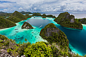 A view from on top of the small islets of the natural protected harbor in Wayag Bay,Raja Ampat,Indonesia,Southeast Asia,Asia