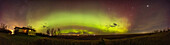 A panorama of the extensive aurora of Oct 20/21,2023,from home in southern Alberta. The aurora coloured much of the sky,but was most prominent as a larrge diffuse arc across the north,with a more active structured arc low in the north. This was at local midnight,MDT.