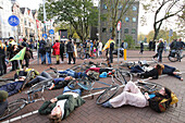 Environmental activists from Extinction Rebellion block the street attend the March For Climate And Justice on November 12,2023 in Amsterdam,Netherlands. Protestors demand action from the Dutch government and world leaders to combat the climate change crisis,heat records are being broken again and again,resulting in profound changes for all life on Earth. An estimated 70,000 people have walked on Sunday with the climate march in Amsterdam,according to the Amsterdam municipality.