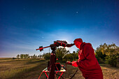 A selfie of me observing Saturn – the object to the left of the telescope - on August 28,2023,with Saturn near opposition this night,and with the almost Full Moon lighting the sky and ground,but here hidden behind the telescope. I am observing with the 30-year-old (but still superb) Astro-Physics 130EDT refractor on the AP Mach1 mount.