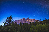 The stars of the northern sky over Castle Mountain in Banff National Park,Alberta. This was June 6,2023 on a very clear night,but bright with blue summer twilight at this latitude of 51° N in June. The W of Cassiopeia and the Milky Way are at right. Polaris is at top.