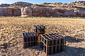A battery of launchers for 4" & 6" pyrotechnic shells being prepared for a fireworks show in a field in Utah.