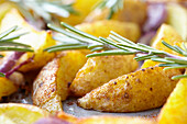 Potato wedges with rosemary and onions