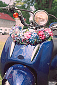 Motor scooter with hydrangea flower arrangement