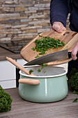 Stuffing kale into pot