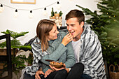 Christmas - Couple eats nuts