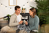 Christmas - Couple drinks wine