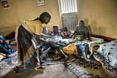 Health worker serving coffee