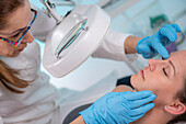 Dermatologist checking skin