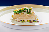 Turbot with vegetables and edible flowers