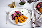 Breaded vegetable sticks with red cabbage salad