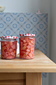 Preserved red-fleshed apples in jars