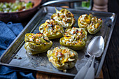 Baked pepper halves filled with feta and leek