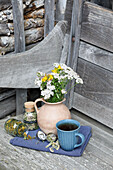 Dried herbal teas in jars with a cup of tea