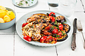 Loin steaks with grilled aubergines and tomato ragout