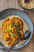 Pearl barley curry on chickpea puree