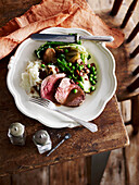 Peppered beef fillet with french-style peas