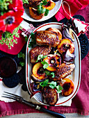 Duck with spiced roasted peaches
