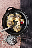 Vegan cherry dumplings with poppy seed sugar