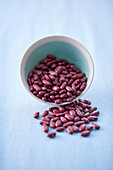 Red beans in a porcelain bowl and next to it