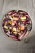 Red chicory salad with roasted yellow beetroot, onions, apples and walnuts
