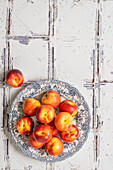 Nectarines on a blue and white plate