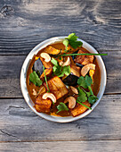 Vegetable curry with cashews and coriander greens