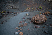 Volcan del Cuervo (Crow volcano) a crater explored by a loop trail in a barren, rock-strewn landscape