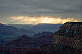 Stormy clouds at sunrise over the Grand Canyon in Grand Canyon National Park in Arizona.
