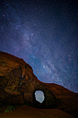 Milky Way over arch in Monument Valley Navajo Tribal Park, Arizona.