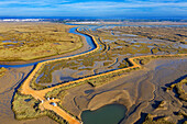 Aerial view of Salinas del Duque saltworks walking road marshes Isla Cristina, Huelva Province, Andalusia, southern Spain.