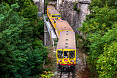 Pont d´Olette sur la Têt. The Yellow Train or Train Jaune between Thuès les Bains and Olette, Pyrénées-Orientales, Languedoc-Roussillon, France.