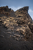 Volcan del Cuervo (Crow volcano) a crater explored by a loop trail in a barren, rock-strewn landscape