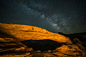 The Milky Way Galaxy over Mesa Arch at night in the Island in the Sky District of Canyonlands National Park, near Moab, Utah.